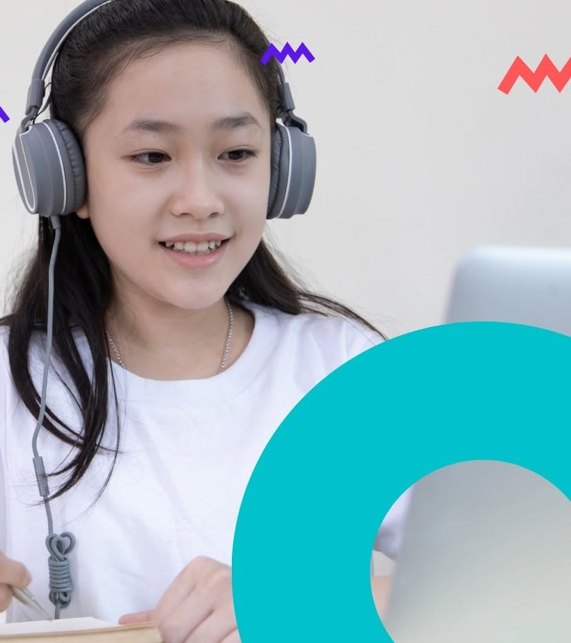A student wearing headphones practices Spanish online